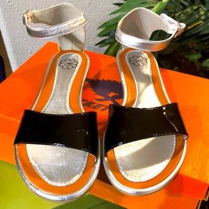 Cute black patent leather and silver sandals.